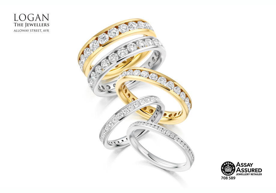 Three platinum white gold and two yellow gold diamond wedding rings